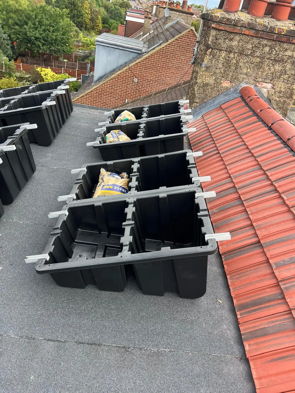 The ballast trays set out on the dormer roof and weighted, before the panels.