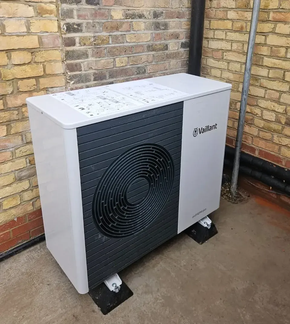 The aroTHERM plus on its feet against the side wall.