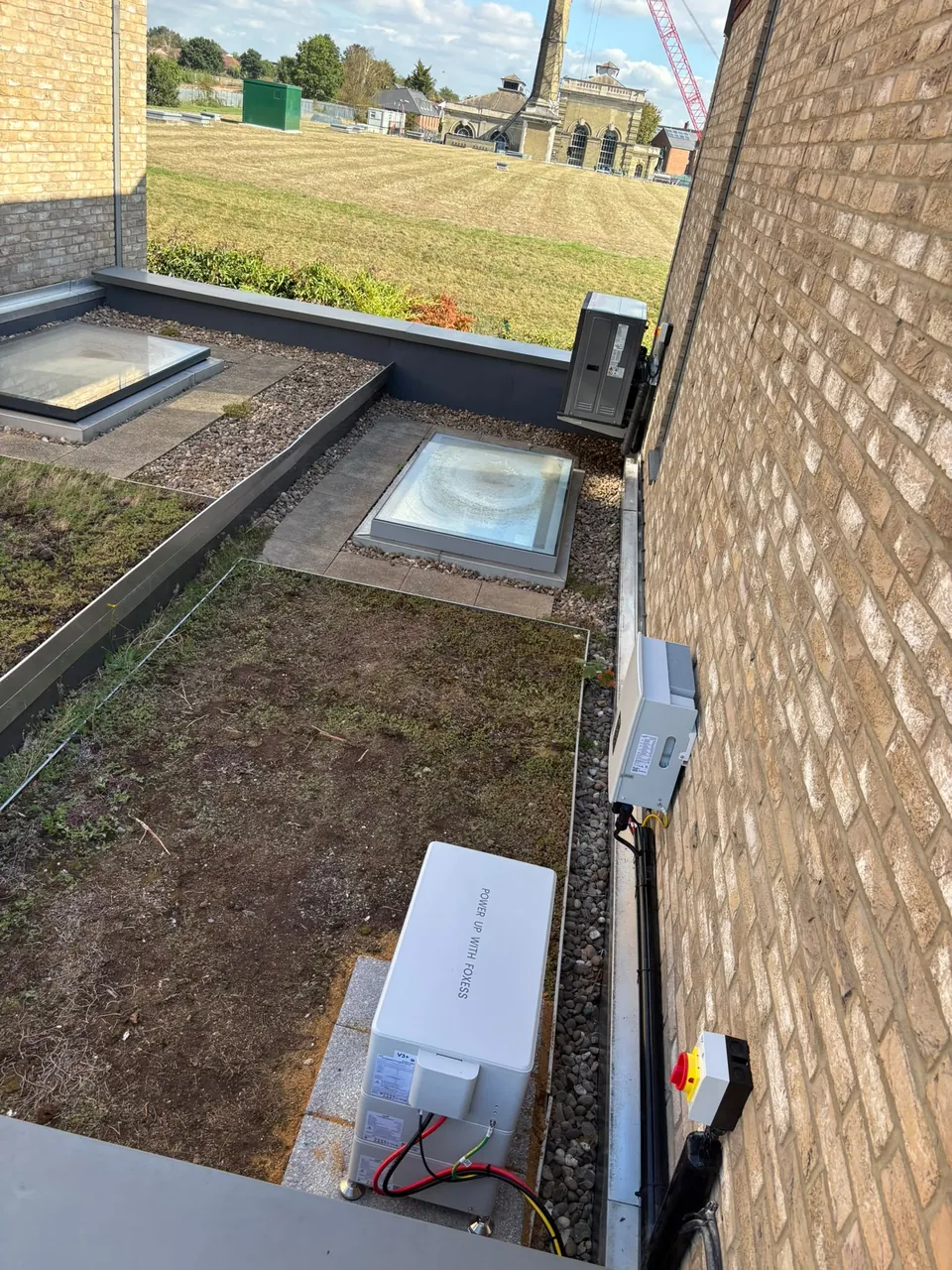 The terrace and rooflights, with the battery kept against the wall line.