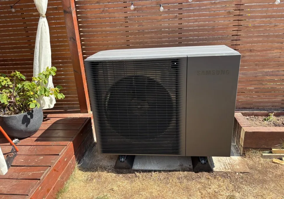 The 12kW Samsung unit on its own base at the end of the garden.