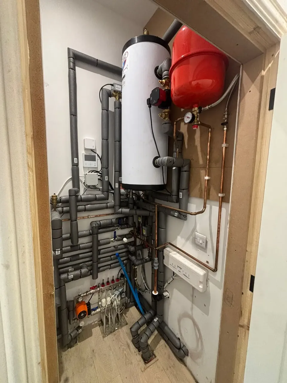 The 300-litre cylinder, buffer and zone valves in the cupboard.