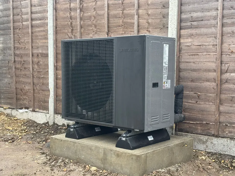 The Samsung Gen 7 on anti-vibration feet on its concrete base beside the fence.