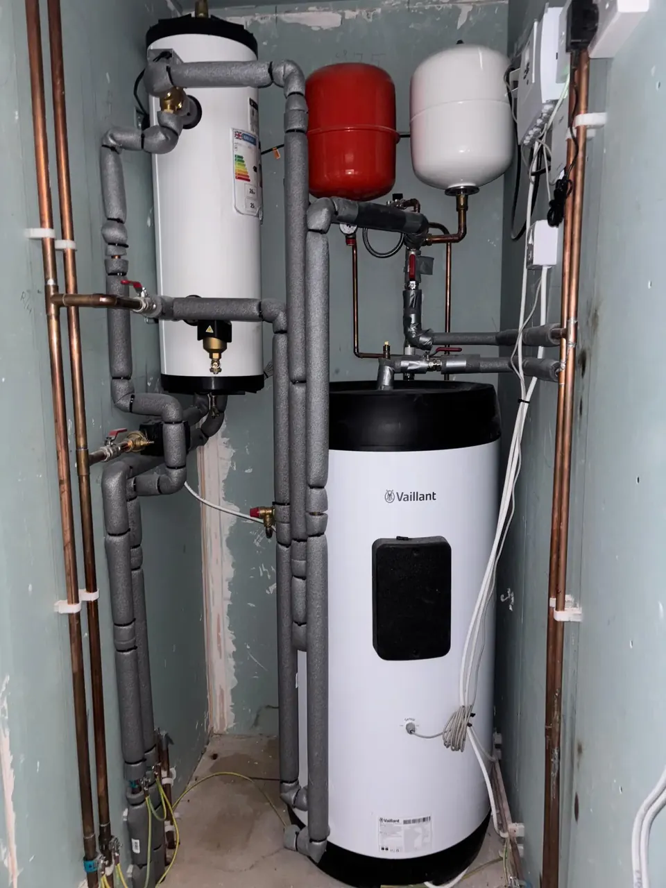 The cylinder and buffer, with every pipe insulated and labelled.