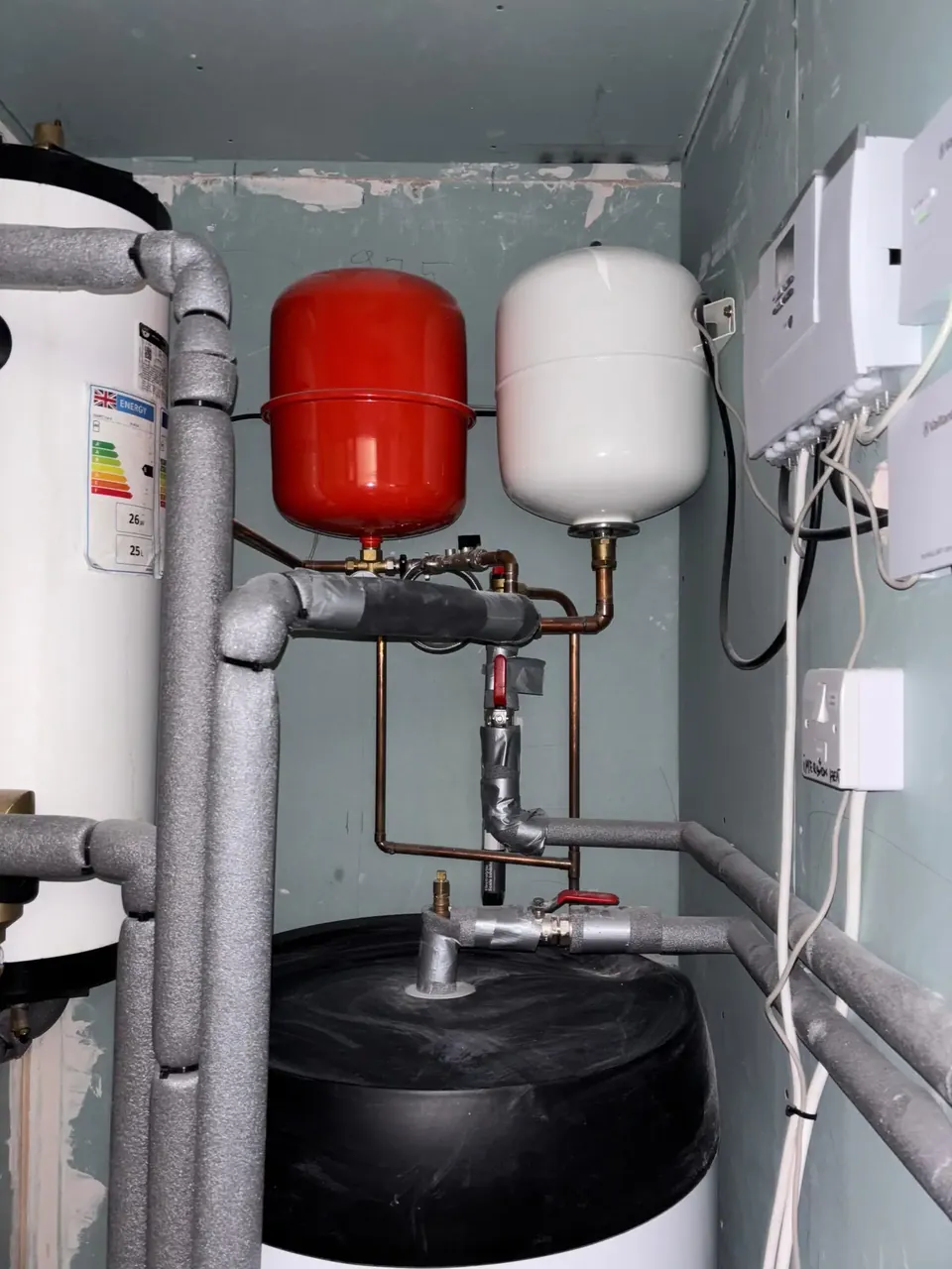 The valves, pump and expansion vessels above the cylinder.