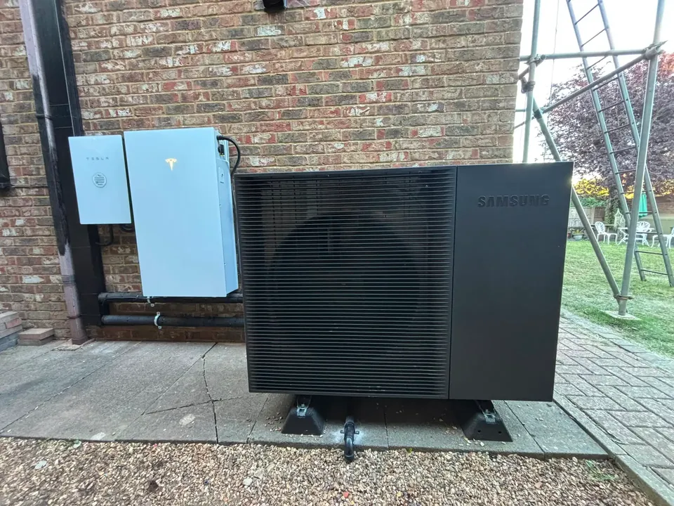 The Samsung heat pump and the Tesla Powerwall 3 on the same wall.