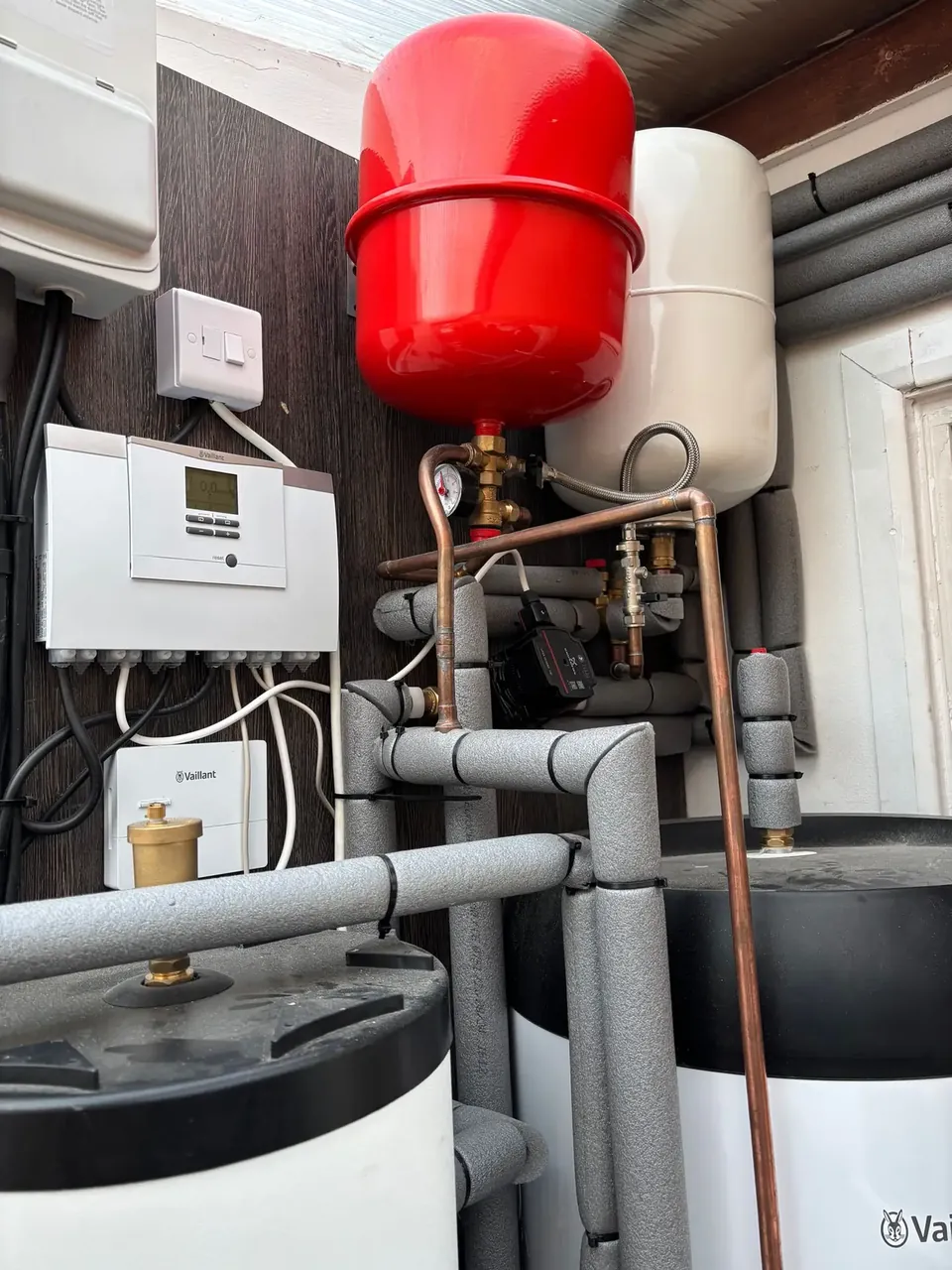 The controller, expansion vessels and valves above the cylinders.