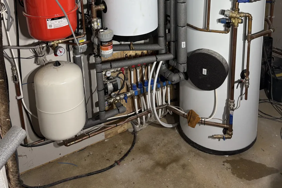 The underfloor heating manifold, the magnetic filter and the two expansion vessels.