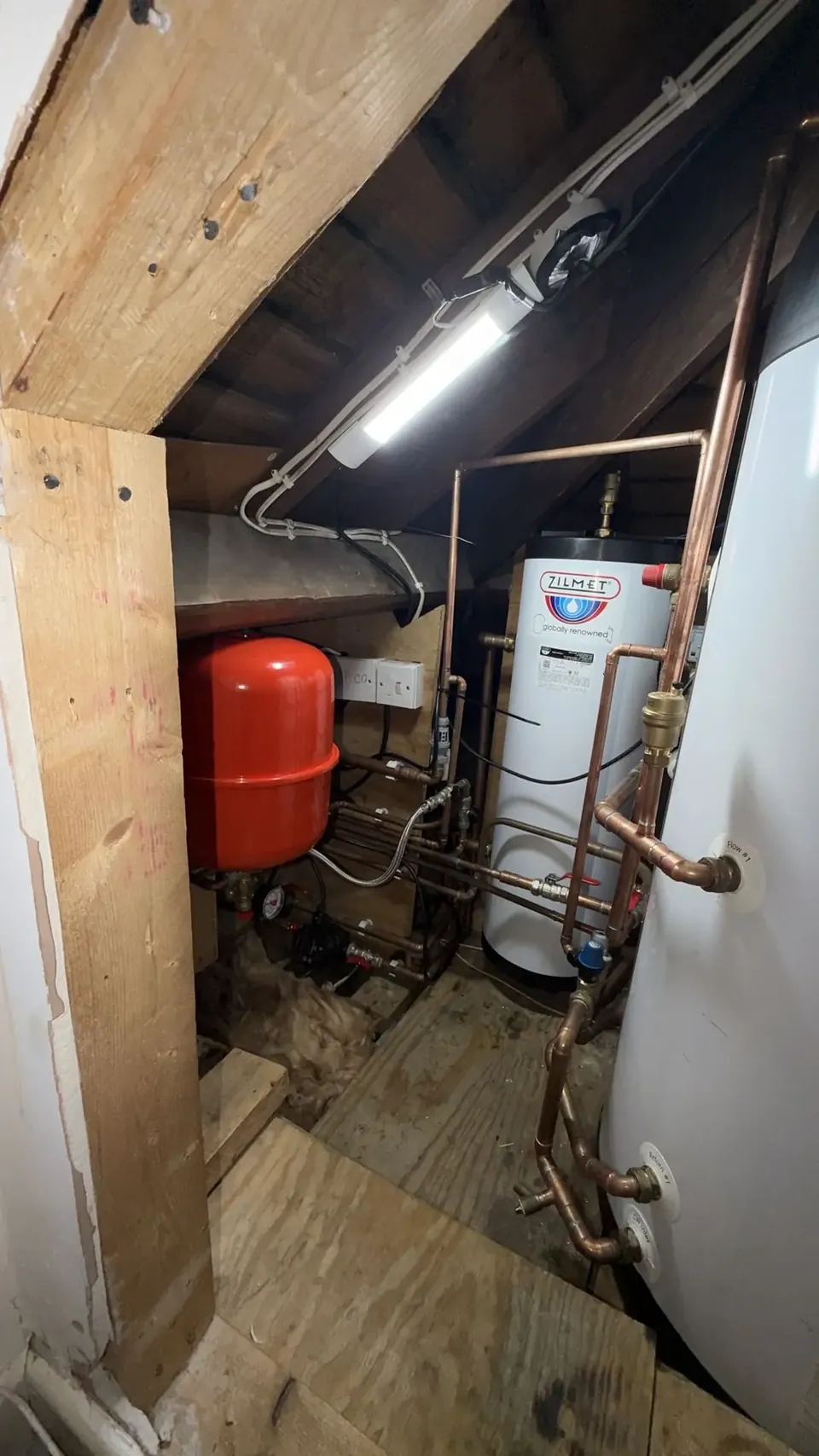 The cylinder and expansion vessel in their own space inside.