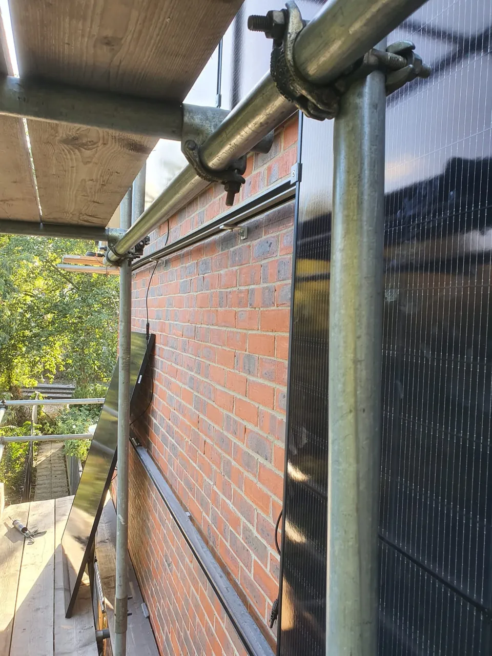 The wall panels from the scaffold platform.
