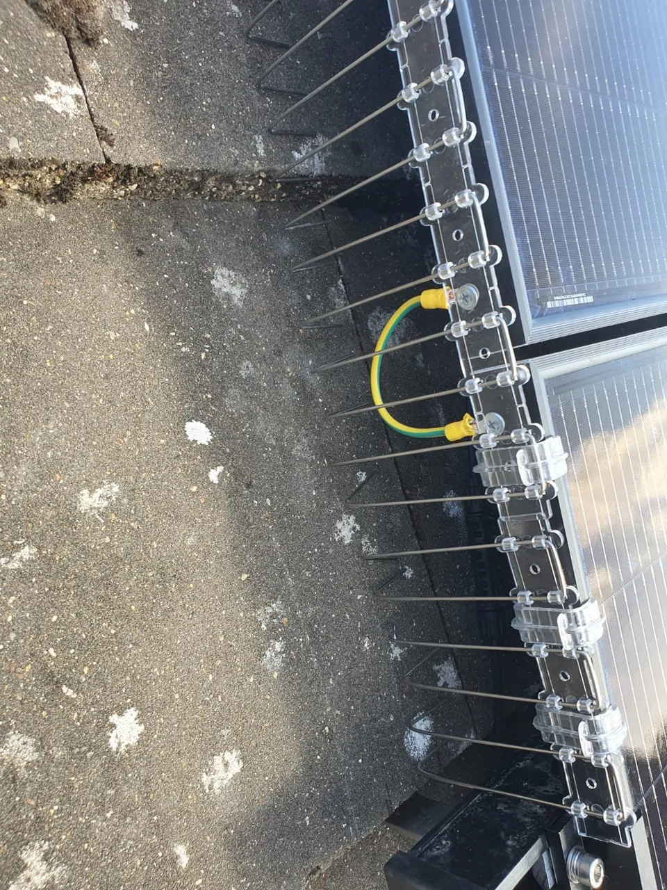 Earth bonding cable between two panel frames.