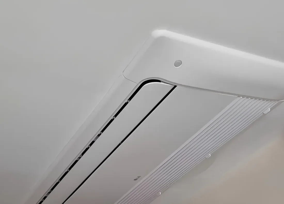 Ceiling mounted ducted air conditioning outlet recessed into a plastered ceiling